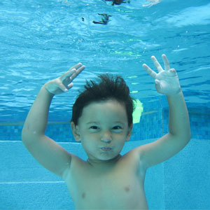 Boy Swimming in a Swimming Pool 